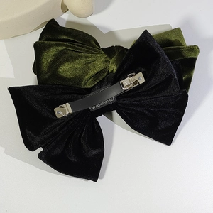 Elegant velvet bow hair clips in black and dark green with spring metal fasteners