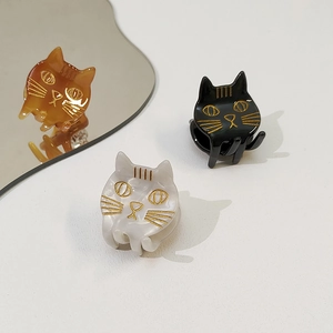 Trois pinces à cheveux chat en acétate, coloris noir, crème marbré et ambre écaille