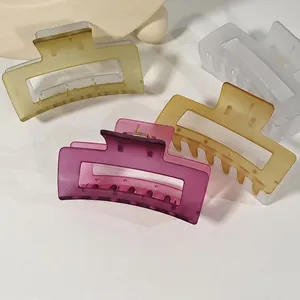 Matte rectangular large hair claw clips in amber, purple, and cream colors