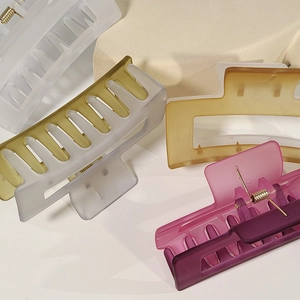 Matte oversized hair claw clips in various colors with translucent resin finish