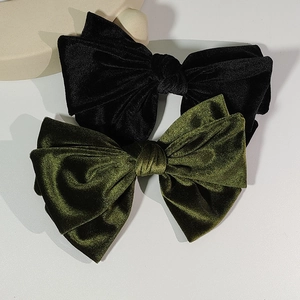 Elegant vintage velvet bow hair clips in black and olive green colors for women