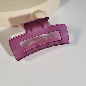 Detailed view of deep purple matte oversized hair claw clip for thick hair styling