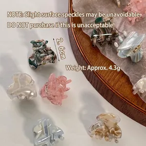 Mini acetate hair claw clips with marble pattern in assorted colors for styling