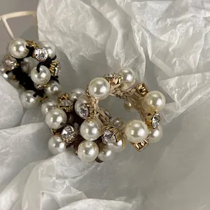 Elegant pearl and crystal hair ties set with elastic braided ropes and gold-tone details
