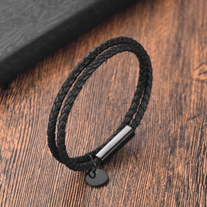 Minimalist double-wrap braided leather bracelet with matte black magnetic clasp and metal tag