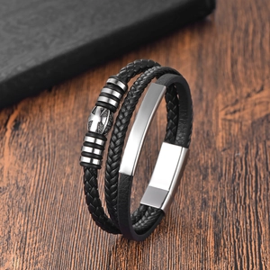 Men's multilayer black leather bracelet with stainless steel cross beads on wood background