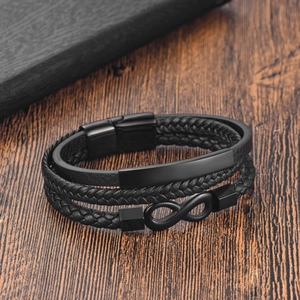Men's triple-layer braided leather bracelet featuring a black infinity symbol and metal tag
