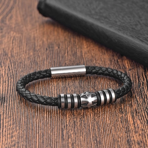 Handwoven black leather bracelet with a silver stainless steel cross charm and magnetic clasp