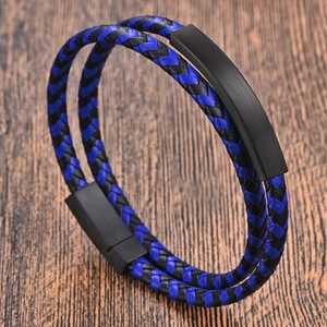 Detail of blue and black braided leather men's bracelet with matte magnetic clasp