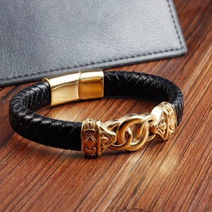 Close-up of black braided leather bracelet with gold stainless steel magnetic clasp