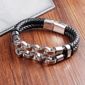Close-up of black braided leather bracelet with silver stainless steel chain and metal clasp