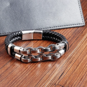 Detail of men's double-layer braided leather bracelet with stainless steel metal chain links
