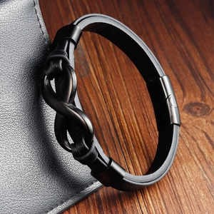 Men's black braided leather bracelet featuring a matte black infinity symbol and metal clasp