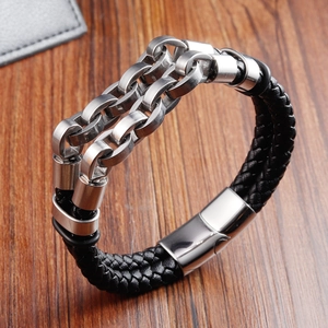 Men's double-layered black braided leather bracelet with stainless steel chain on wood