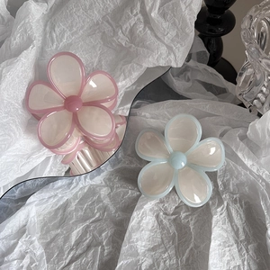 Jelly colored flower hair claw clips set in pastel pink and blue with a glossy finish