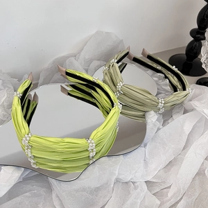 Satin pleated headbands in light green and sage green with pearl bead strand accents