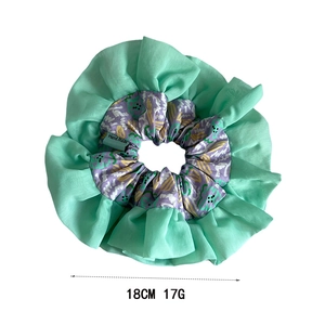 Elegant floral chiffon ruffle hair scrunchie with a handmade label for low ponytail
