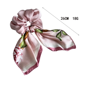 Pink floral satin scrunchie with long ribbons and elegant flower patterns for women
