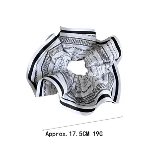 Large striped and checkered hair scrunchie in black and white, 17.5cm diameter