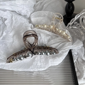 Elegant large pearl claw clips with bow decoration and rhinestones for thick hair styles