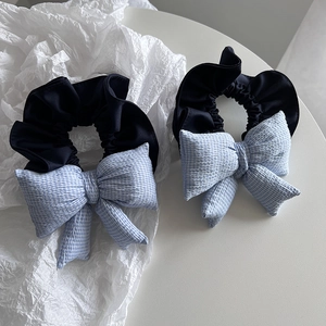 Set of two sweet blue checkered bow scrunchies with black elastic hair ties
