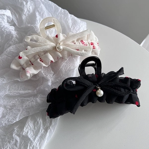 Elegant polka dot bow claw clips with pearl pendants in black and cream chiffon fabric