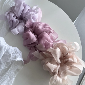 Detailed texture of organza oversized hair scrunchies in pastel colors for women