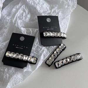 Set of four black rectangular BB hair clips with shiny K9 crystals for a stylish front fringe