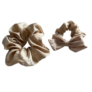 Premium champagne satin scrunchie set with sparkling rhinestones and bow detail