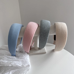 Set of four wide sponge headbands in blue, pink, gray and beige with ribbed texture