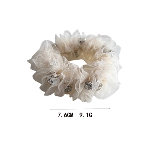 White seersucker scrunchie with shiny rhinestones and layered ruffle design