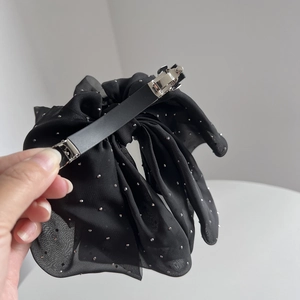 Elegant black chiffon bow hair clip with silver studs and metal spring fastener
