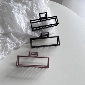 Three-piece set of matte rectangular hair claws in black, dark brown, and dusty pink