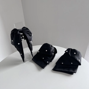 Elegant black satin bow hair claw clip with pearl accents for women fashion hair styling