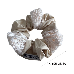 Handmade cotton patchwork scrunchie with beige fabric and white crochet embroidery detail