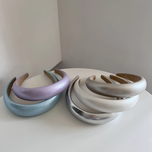 Minimalist metallic sponge padded headbands in assorted colors for high-volume hair look