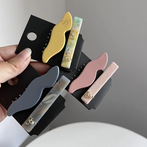 Chic acetate hair clip set with wavy designs and pearl butterfly accents for women