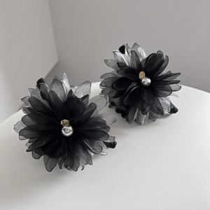 Elegant organza flower hair clips in grey and black with pearl detail and metal accent