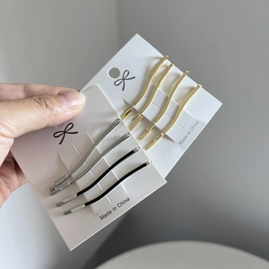 Minimalist S-shaped wave metal hair clips set in gold, silver, and black colors