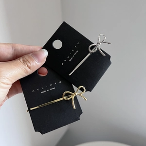 Sweet Korean metal bow hair clip set in gold and silver finish shown on backcard