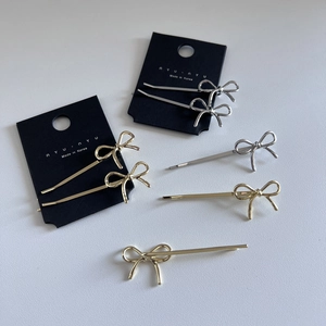 Sweet Korean metal bow hair clips in gold and silver set on a display card