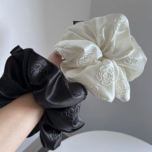 Elegant satin oversized scrunchies with camellia embroidery in black and beige tones