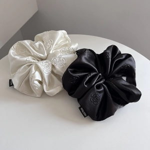 Elegant set of black and white velvet scrunchies with camellia pattern and handmade label