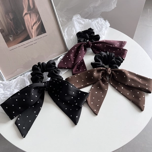 Three-piece satin bow hair scrunchies set with heart patterns in black, red, and brown