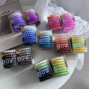 Set of colorful gradient TPU telephone cord hair ties in premium transparent box packaging