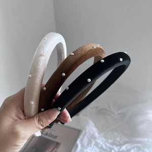 Three-piece velvet headband set with elegant pearls in cream, brown, and black colors