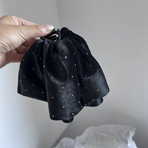 Elegant black velvet hair scrunchie with sparkling silver rhinestones and ruffled design
