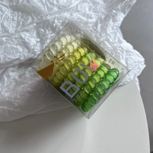 Set of high-elastic gradient green TPU spiral hair ties in transparent storage box