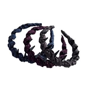 Set of three polka dot fabric headbands with non-slip tooth combs in blue purple and grey