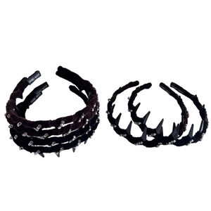 Velvet headband set with rhinestones, pearls, and spikes for a high crown hairstyle